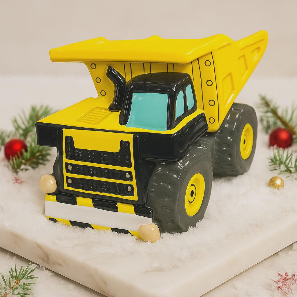 dump truck on a snowy surface with Christmas decorations