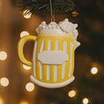 Load image into Gallery viewer, Yellow mug ornament with white foam on a blurred Christmas tree background
