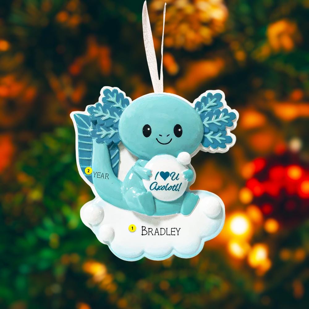Blue axolotl ornament with 'I ❤️ You Axolotl!' text on a blurred Christmas tree background