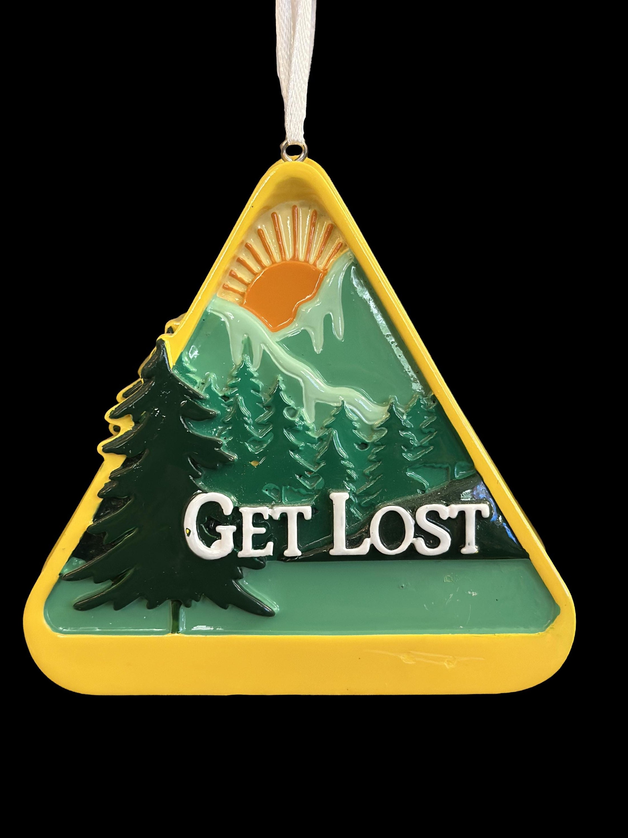 Decorative ornament with a mountain and tree design and 'Get Lost' text on a yellow triangle.