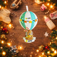 Load image into Gallery viewer, A personalized baby boy ornament featuring a cute bunny riding a pastel blue hot air balloon. Soft blue and white tones with gentle decorative details create a calm and cozy look. Handwritten personalization includes baby name and year. Mostly 2D ornament with raised 3D details on the front only, lightweight and easy to hang, perfect for baby first Christmas, nursery decor, and toddler keepsakes.
