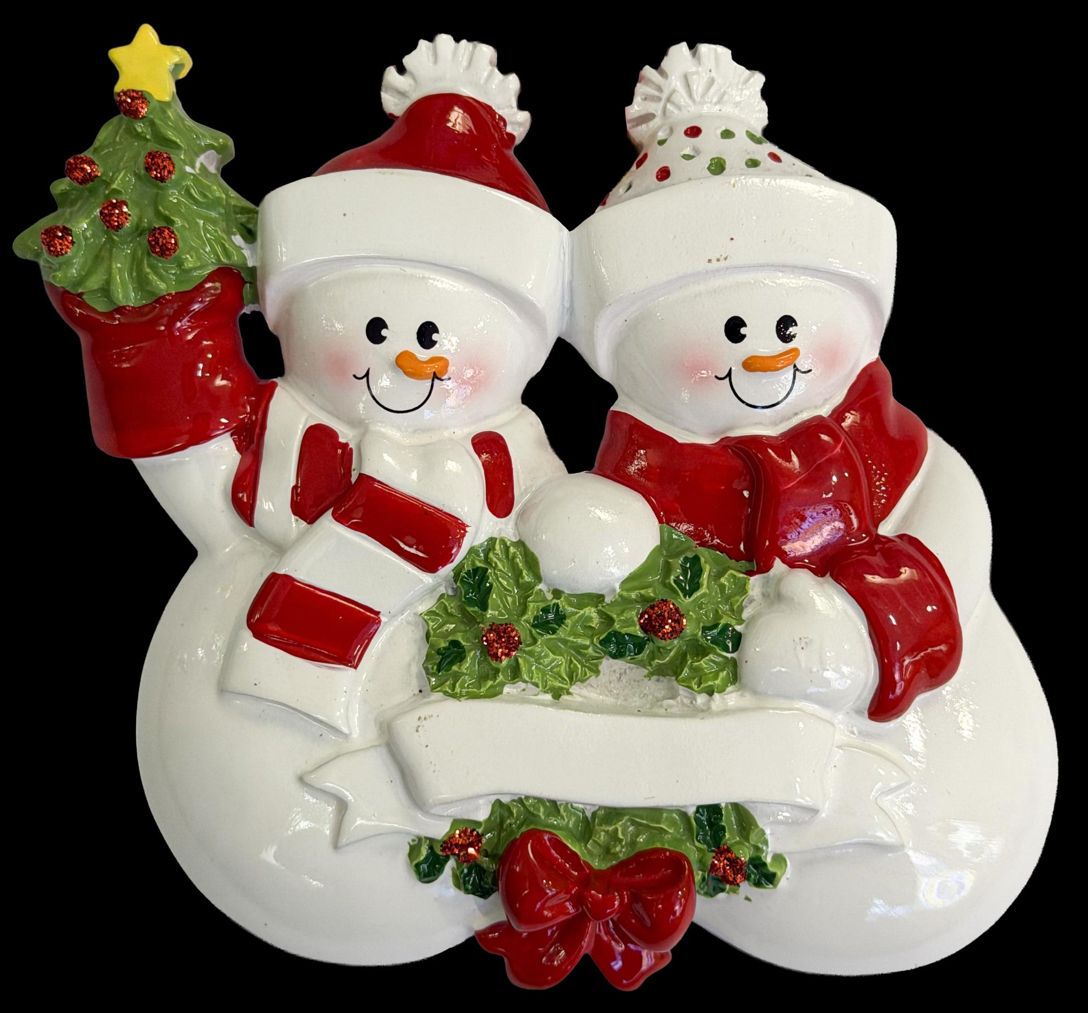 Decorative snowman couple ornament with a black background