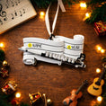 Load image into Gallery viewer, Music-themed ornament with name and year fields on a wooden surface with Christmas decorations.
