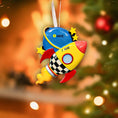 Load image into Gallery viewer, Colorful rocket-shaped ornament with customizable text on a blurred Christmas tree background
