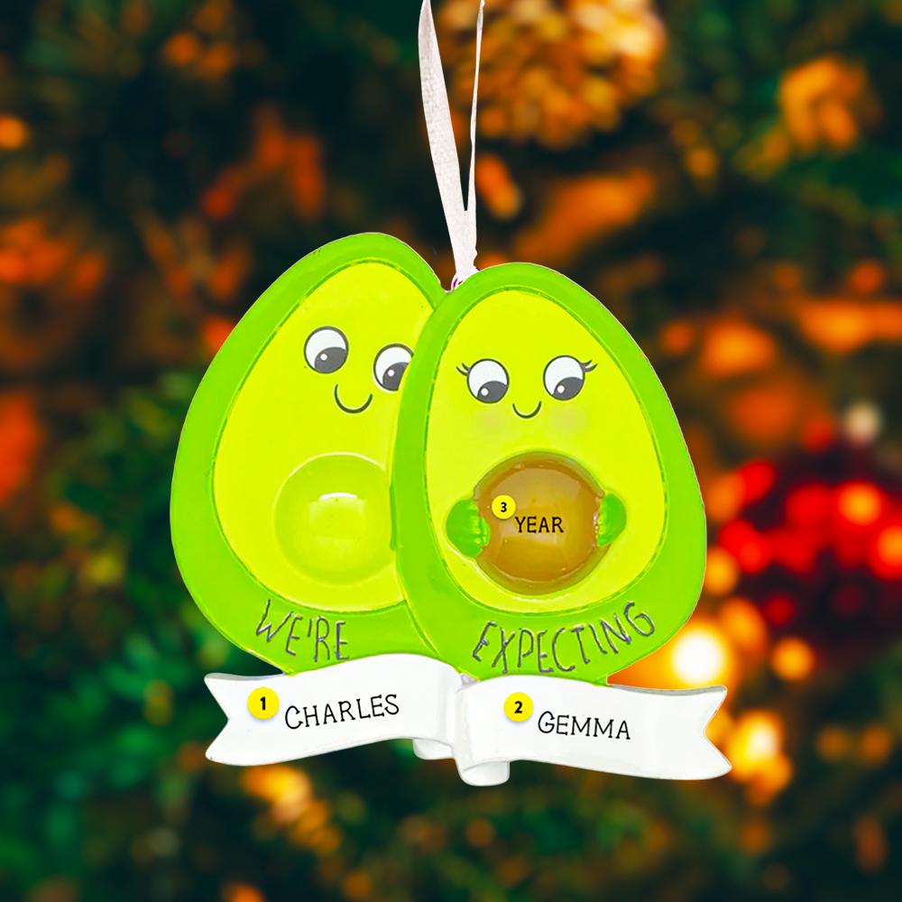 Personalized expecting couple ornament featuring a cute avocado couple design celebrating pregnancy and growing families. This joyful Christmas ornament can be customized with two names and a year, making it perfect for pregnancy announcements, expecting parents, baby reveals, and first Christmas as a family. A playful and heartwarming keepsake that captures love, excitement, and the beginning of a beautiful new chapter together.