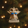 Load image into Gallery viewer, Decorative ornament with goat face, sunglasses, and 'G.O.A.T. Greatest of All Time' text on a Christmas tree.
