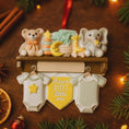 Load image into Gallery viewer, Decorative baby shower ornament with teddy bear, elephant, and other elements on a wooden surface.
