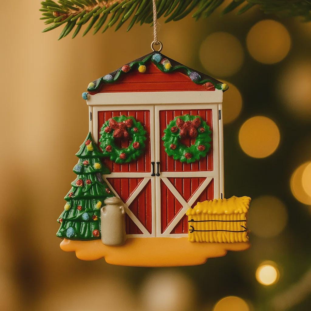 Decorative Christmas ornament shaped like a red barn with wreaths, a tree, and a lantern on a blurred Christmas tree background.