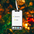 Load image into Gallery viewer, Phone-shaped ornament with 'Samantha' and 'Year' text on a blurred Christmas tree background
