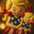 Load image into Gallery viewer, Decorative figurine of a woman holding a child with a blurred bokeh background
