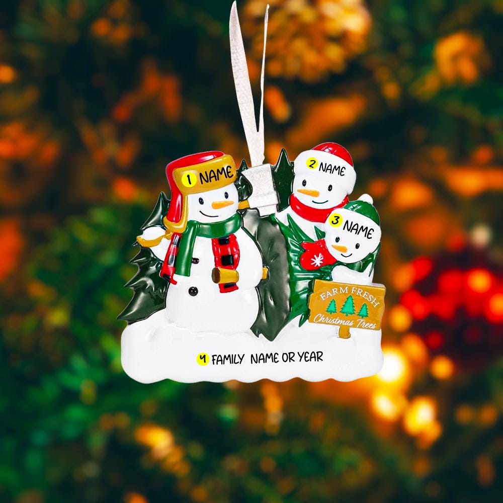 Personalized Christmas ornament with 3 snowmen , against a blurred festive background.
