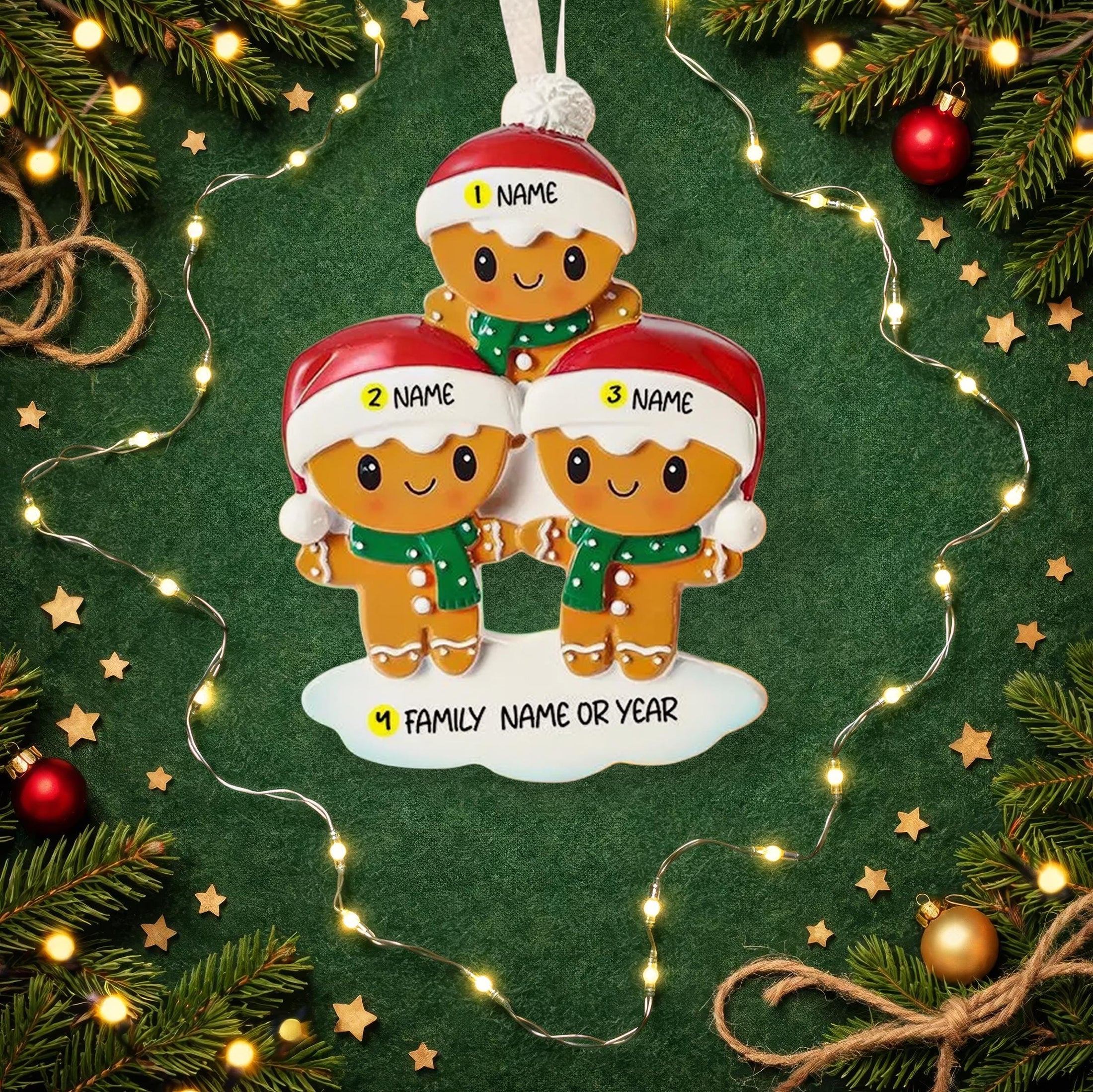 Personalized gingerbread family Christmas ornament on a green background with lights and decorations.