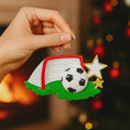 Load image into Gallery viewer, Personalized soccer ornament featuring a detailed goal and ball design with a glossy finish and raised 3D details. The ornament includes one custom name and year displayed on the front. Styled with festive lighting and greenery, this sports themed ornament is perfect for soccer lovers, players, and coaches. Designed with a 3D front and flat back, lightweight and easy to hang on a Christmas tree or display year round.


