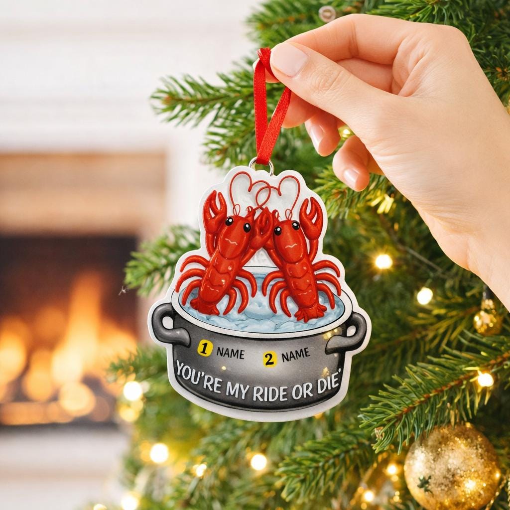 Christmas ornament with two lobsters and text 'YOU'RE MY RIDE OR DIE' on a decorated tree.
