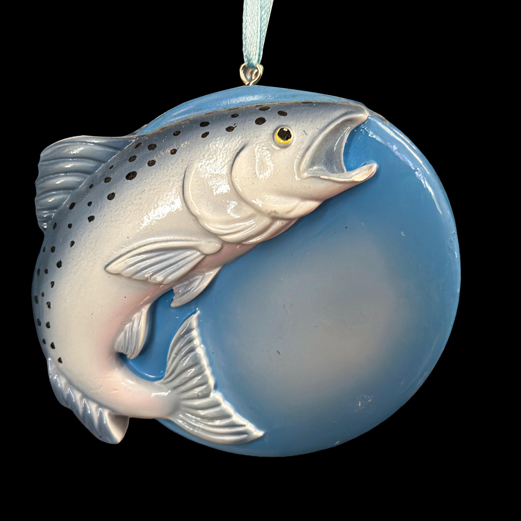Decorative ornament with a Trout fish design on a blue background