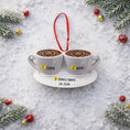 Load image into Gallery viewer, Two gray mugs with heart-shaped coffee art on a white plate, surrounded by Christmas decorations on a snowy background.
