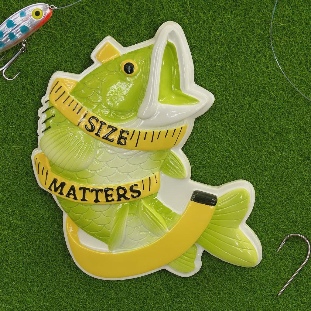 Fishing lure with a fish-shaped ruler displaying 'Size Matters' on a green background