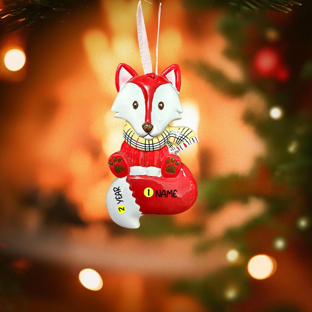 Decorative fox ornament with customizable name tag against a festive background