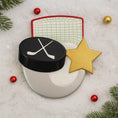 Load image into Gallery viewer, Hockey puck, goal net, and gold star on a snowy background with Christmas decorations.
