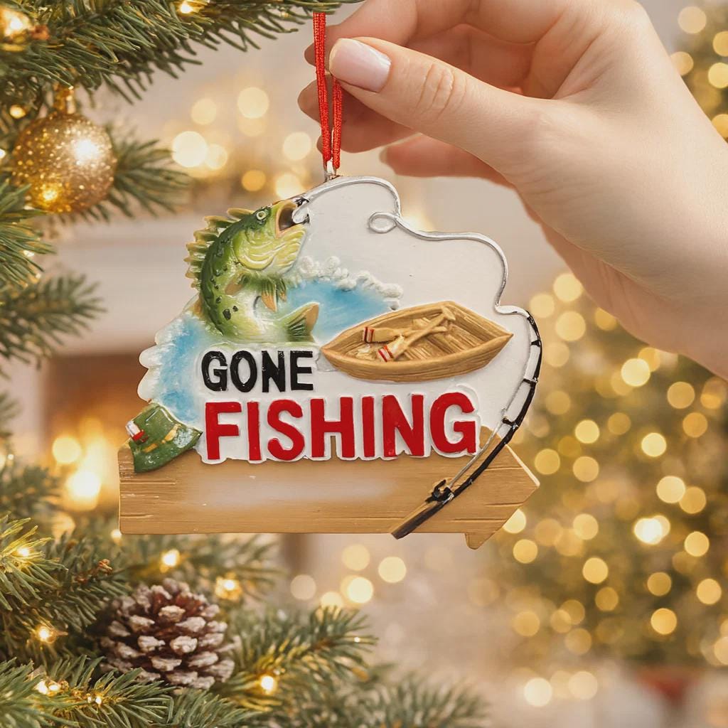Decorative ornament with 'Gone Fishing' text on a Christmas tree.