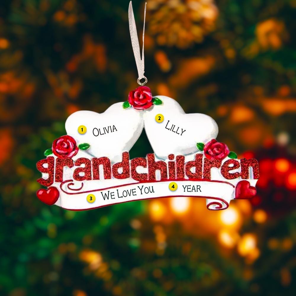 Personalized grandparents Christmas ornament featuring two white heart shapes with custom names, red rose details, glitter red grandchildren lettering and a heartfelt we love you message, designed as a sentimental holiday keepsake for grandparents, displayed on a warm rustic wooden background with cozy Christmas lights, ornaments and festive decor, perfect for celebrating family love and cherished memories during the holiday season