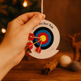 Load image into Gallery viewer, Personalized archery ornament featuring a colorful target and arrows design, customized with a name and year. Perfect for archery lovers, hunters, target shooting fans, and outdoor sports enthusiasts. This unique Christmas ornament celebrates precision, focus, and passion for archery, making it a meaningful holiday keepsake or gift for athletes, hobbyists, and competitive shooters.

