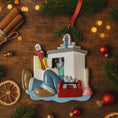 Load image into Gallery viewer, Decorative Christmas ornament of a person in an RV on a wooden surface with festive decorations.
