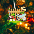 Load image into Gallery viewer, Personalized gardener ornament featuring a detailed garden scene with wooden fence wheelbarrow potted plants gardening tools and soil elements. The design includes a customizable name on the fence and a year on the base making it a thoughtful keepsake for garden lovers. The ornament has a warm rustic farmhouse style and is displayed with a red hanging ribbon suitable for Christmas trees seasonal decor and gift displays.
