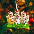Load image into Gallery viewer, Decorative Christmas ornament with three chickens wearing scarves and hats on a blurred Christmas tree background.
