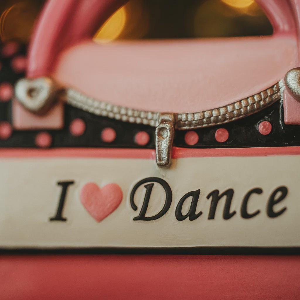Decorative item with 'I ❤️ Dance' text on a pink background