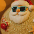 Load image into Gallery viewer, Sunny beach-themed figurine with sunglasses and a crab on sand
