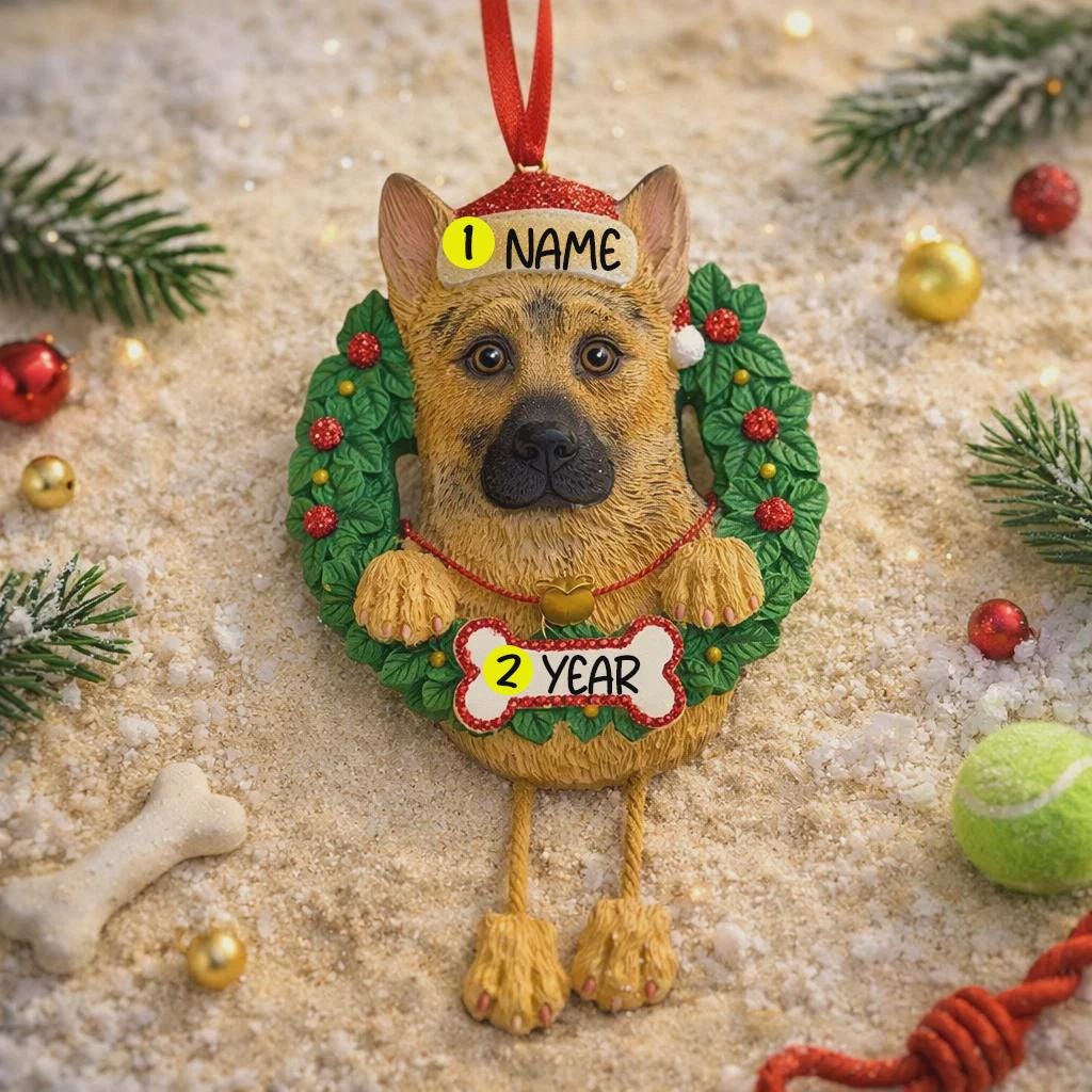 Dog Christmas ornament with wreath, name tag, and bone-shaped tag on a decorative background.