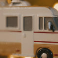 Load image into Gallery viewer, Close-up of a toy bus with beige and white colors
