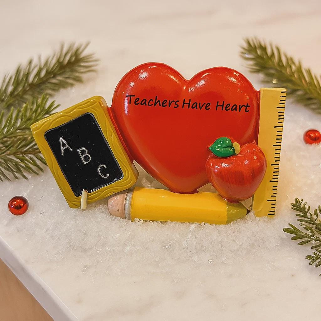 Decorative set with heart, chalkboard, apple, pencil, and ruler on a snowy background.