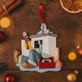 Load image into Gallery viewer, Decorative ornament of a plumber on a wooden surface with Christmas decorations.
