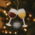 Load image into Gallery viewer, Decorative ornament of two wine glasses with a small sign on a Christmas tree.
