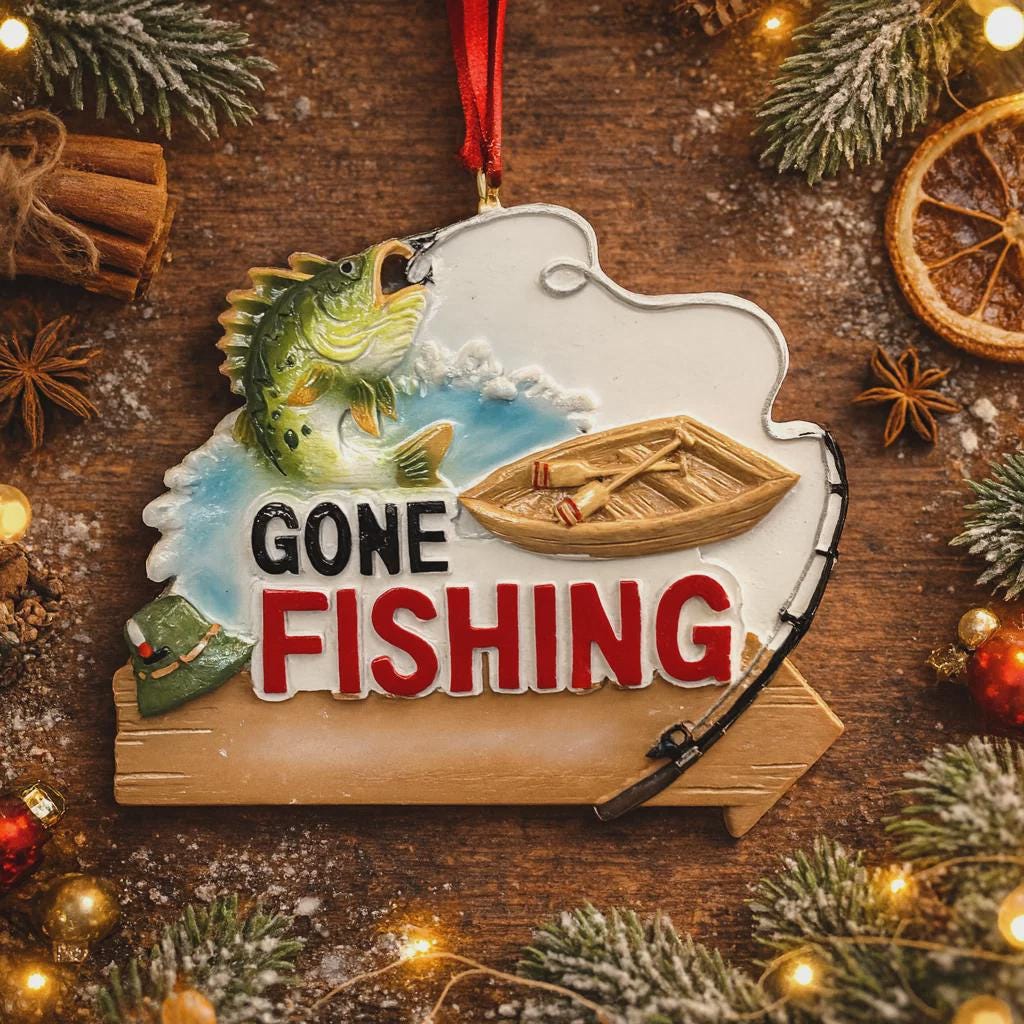Fishing-themed ornament with 'Gone Fishing' text on a wooden background with Christmas decorations.