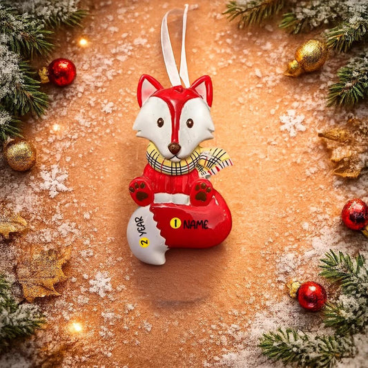 Christmas ornament shaped like a fox with customizable name tag on a festive background