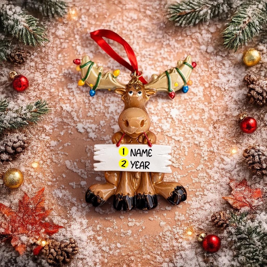 Decorative reindeer ornament with customizable name and year tag on a festive background.