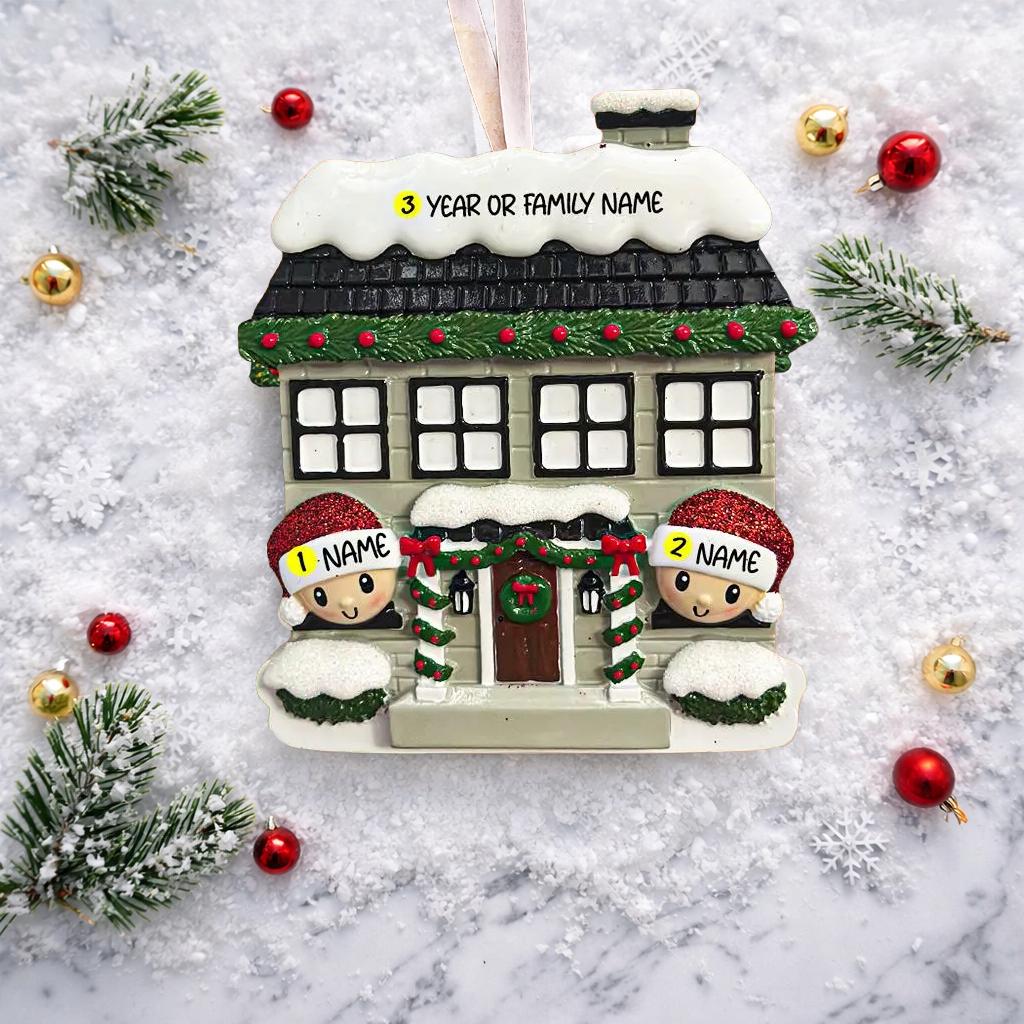 Personalized Christmas house ornament featuring a cozy winter home decorated with snow, wreaths, garlands, and festive details. Two smiling characters wearing Santa hats peek from the front, each customizable with a name, while the roof displays a year or family name. Designed with a detailed 3D raised front and smooth finish, this ornament is perfect for Christmas tree decor, family keepsakes, new home celebrations, and holiday gifting.
