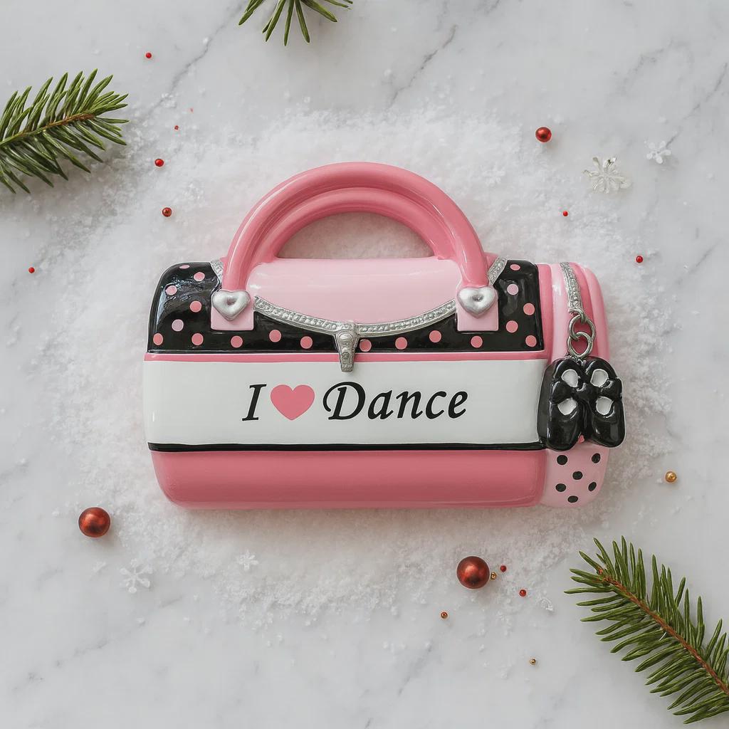 Decorative handbag ornament with 'I ❤️ Dance' text on a snowy background