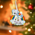 Load image into Gallery viewer, Unicorn ornament with rainbow on a blurred Christmas tree background
