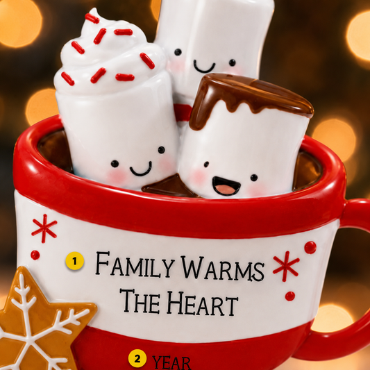 Red mug with marshmallows and text 'Family warms the heart' against a blurred warm light background