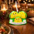Load image into Gallery viewer, ornament item shaped like a family of tacos on a wooden table with candles and food in the background.
