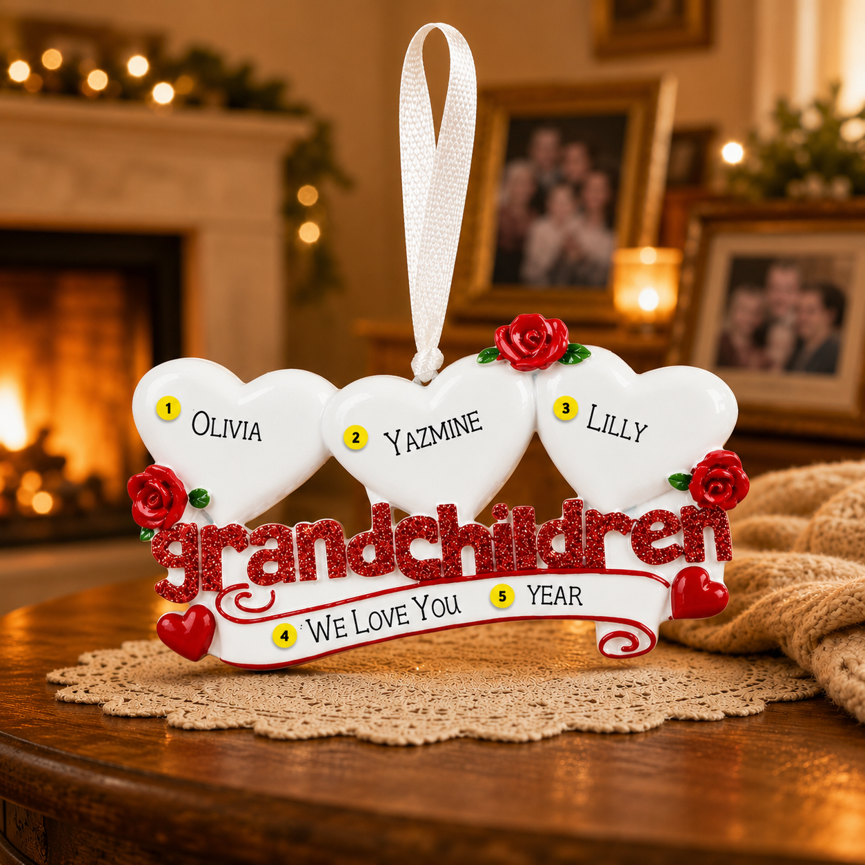 Decorative ornament with hearts and names on a table in a warm, indoor setting.