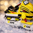 Load image into Gallery viewer, Toy snowmobile with tiger design on a blurred background

