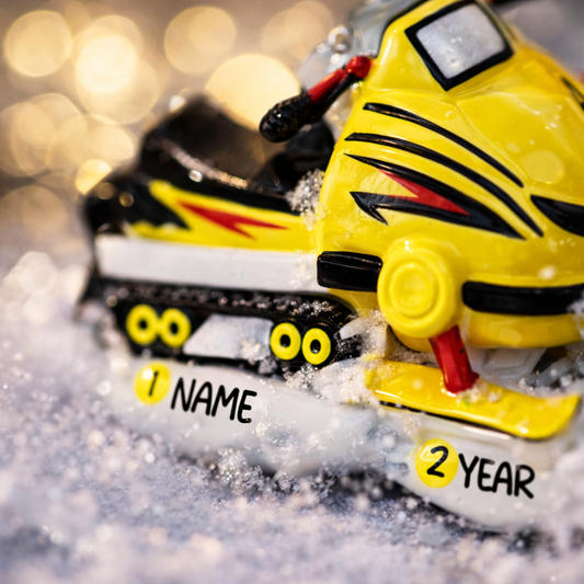 Toy snowmobile with tiger design on a blurred background