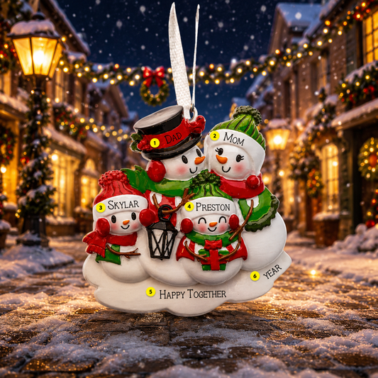 Personalized family ornament with snowmen in a festive village setting