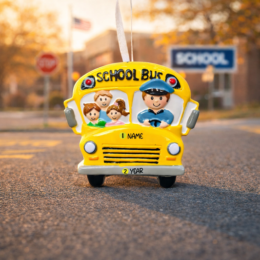 ornament school bus with children and driver on a road with a school sign in the background
