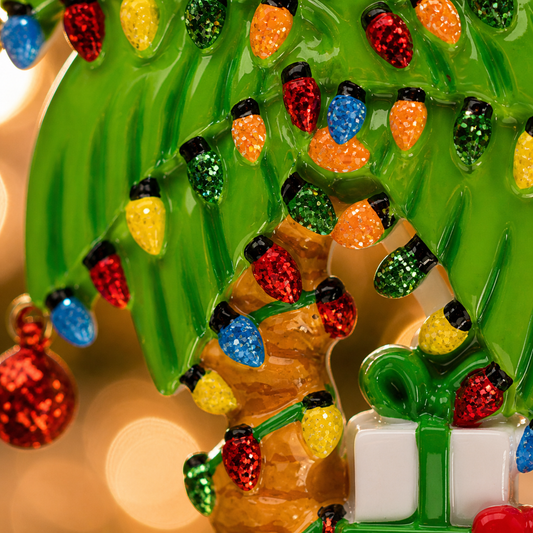 Decorative palm tree ornament with lights and 'Hawaii Best Vacation Ever!' text on a blurred hawaii theme background